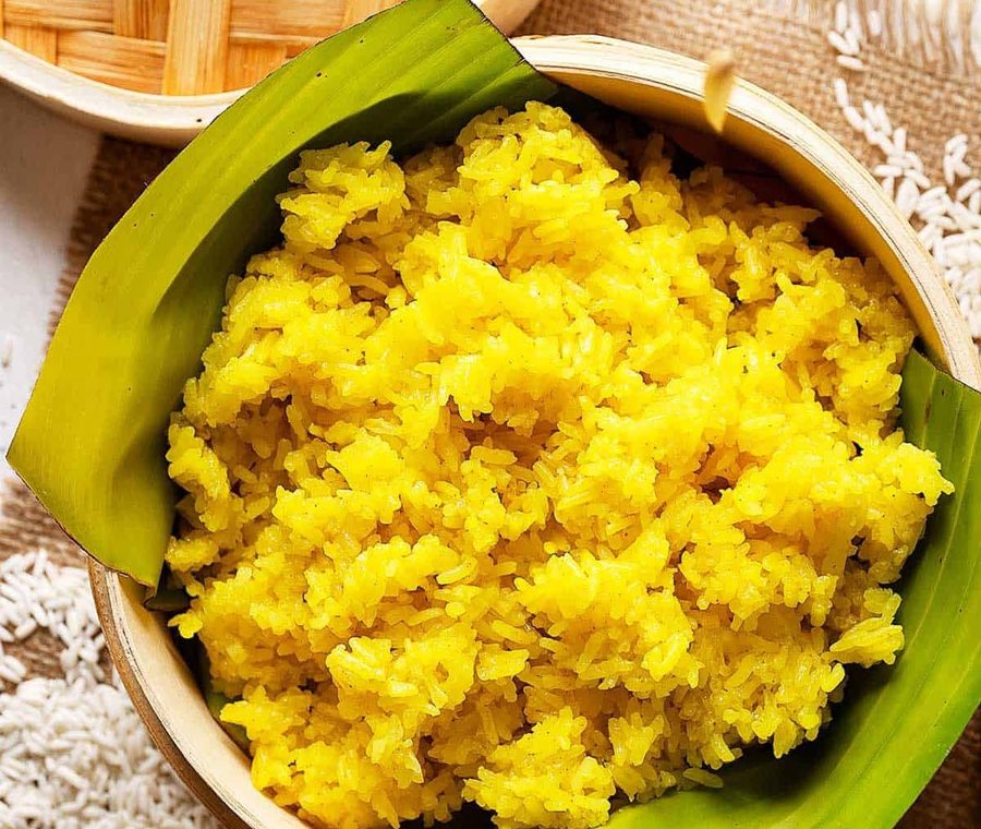 Yellow rice served in a bowl lined with a banana leaf. Photograph posted by Hasina's Burmese Kitchen.